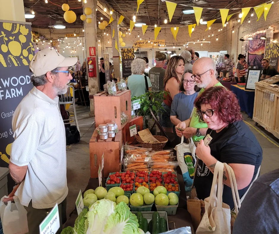 Neighbors browsing fresh produce at Joplin Farmers Market
